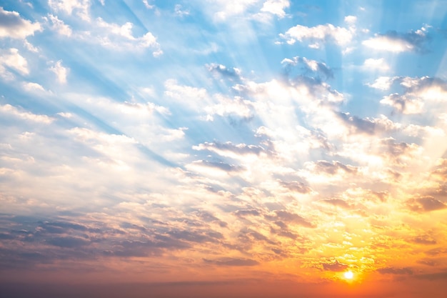 Sky sunrise sunset luxury soft gradient orange gold clouds and gold sunlight between group of blue clound sky perfect for the background take in everningTwilight high definition landscape photo