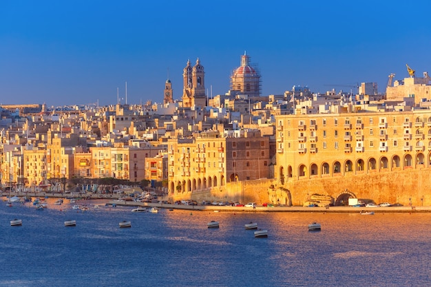 Skyline aerial view of Senglea peninsula as seen from Valletta in the sunny morning, Malta.