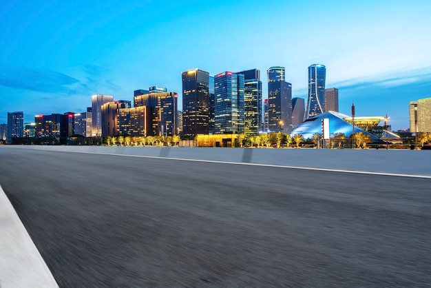 Skyline of asphalt pavement and nightscape of modern architectural landscape