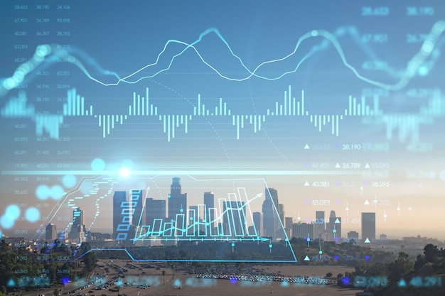 Skyline panorama of Los Angeles downtown at sunset California USA Skyscrapers of LA city Glowing forex chart hologram The concept of internet trading brokerage and fundamental analysis