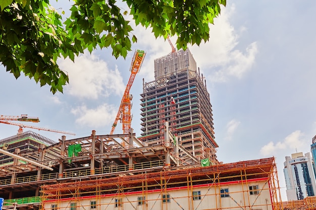 Skyscraper Building under construction in summer day.