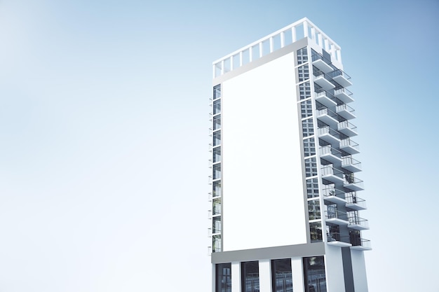 Skyscraper with empty rectangular white billboard banner on blue sky background Public announcement and advertisement concept Mock up 3D Rendering