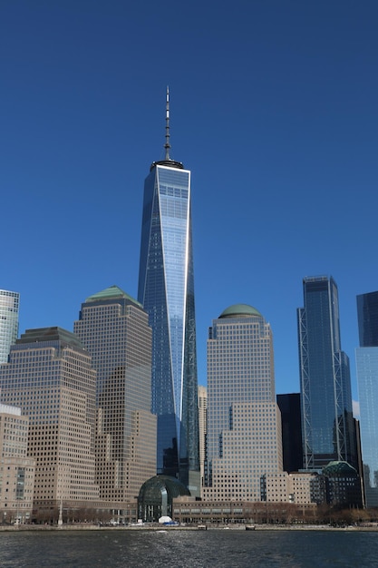 Skyscrapers in city against blue sky