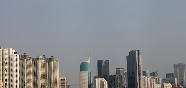 Skyscrapers in city against clear sky