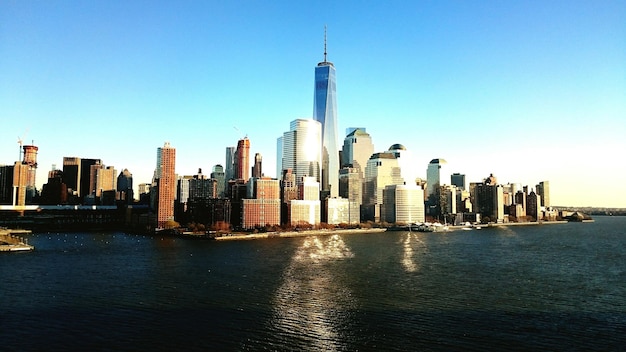 Skyscrapers in city against clear sky