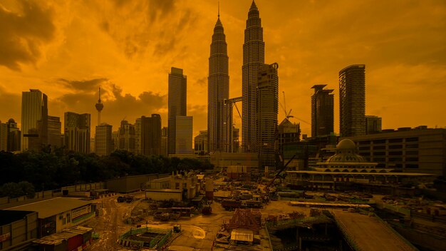 Skyscrapers in city during sunset