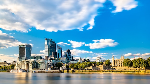 Skyscrapers of the City of London and the Tower of London at the Thames River, England