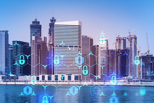 Skyscrapers of Dubai business downtown International hub of trading and financial services Lock icon hologram concept of datum security Double exposure Dubai Canal waterfront