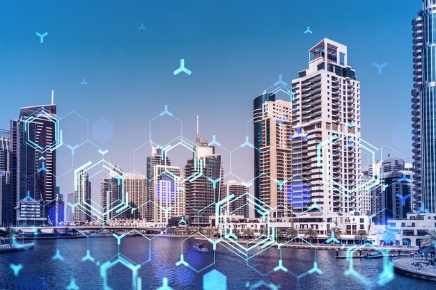 Skyscrapers of Dubai business downtown International hub of trading and financial services Technology theme icons hologram concept of big data Double exposure Dubai Canal waterfront