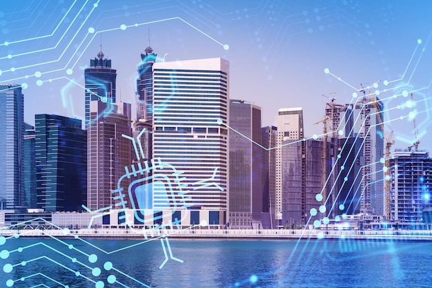 Skyscrapers of Dubai business downtown International hub of trading and financial services Technology theme icons hologram Fintech concept Double exposure Dubai Canal waterfront