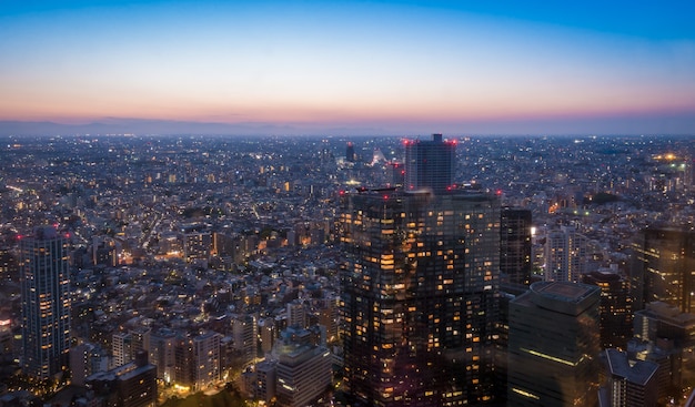 Skyscrapers in Shibuya lighten up at sun set.