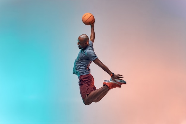 Premium Photo | Slam dunk full length of young african backetball ...