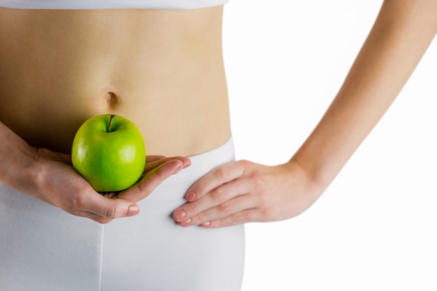 Foto slanke vrouw met groene appel