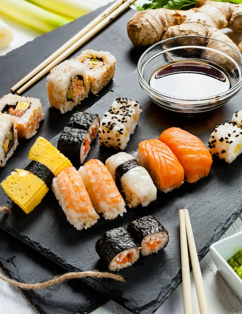 Slate tray of assorted sushi