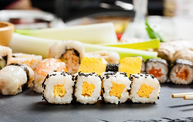 Slate tray of assorted sushi