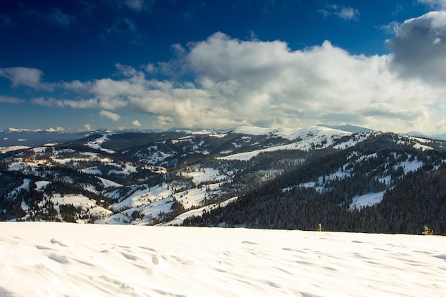 Slavske ski slope with blue sky surrounded by mountains and forests Carpathian Mountains Ukraine