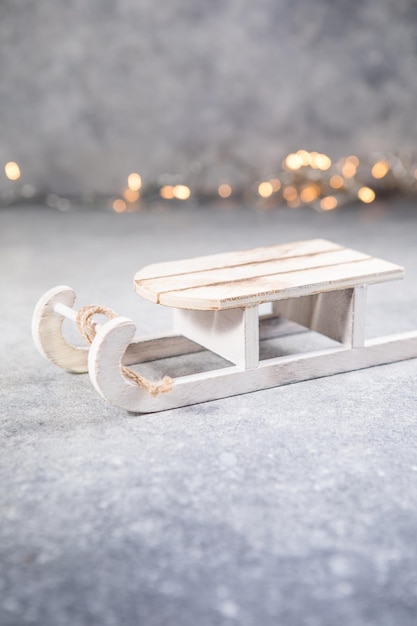 Sled on a snowy background Beautiful winter postcard Concept for Christmas holidays
