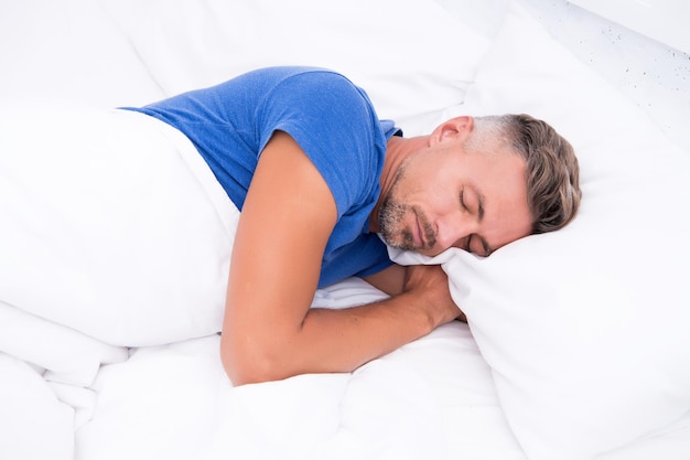 Sleeping beauty. Man handsome guy lay in bed. Get enough amount of sleep every night. Tips sleeping better. Bearded man sleeping face relaxing on pillow. Pleasant relaxation concept. Perfect rest.