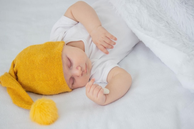 Sleeping child in bed holding teddy bear Selective focus