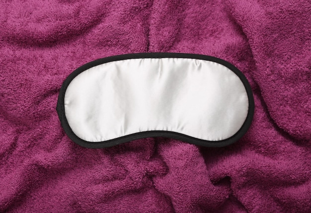 Photo sleeping mask on a towel close up