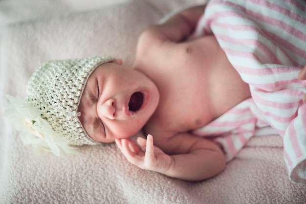 sleeping newborn baby on a blanket