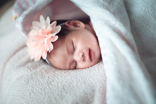 sleeping newborn baby on a blanket