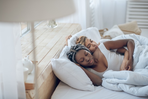 Photo sleeping. two girls sleeping together in the bed