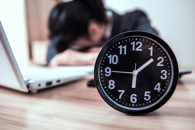 Sleeping woman with clock