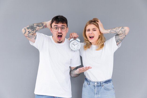 sleepy couple stressing at early morning time management punctuality and discipline tired family