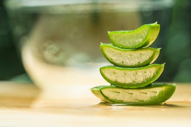 slice of aloe vera on wood top table