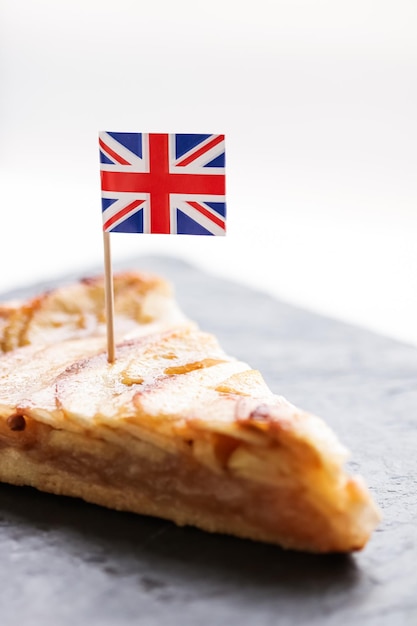 Slice of apple pie and british flag tart dessert and sweet food