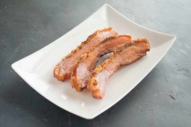 Slice of bacon on plate