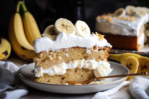 A slice of banana cake topped with dollops of whipped cream and sliced fresh bananas