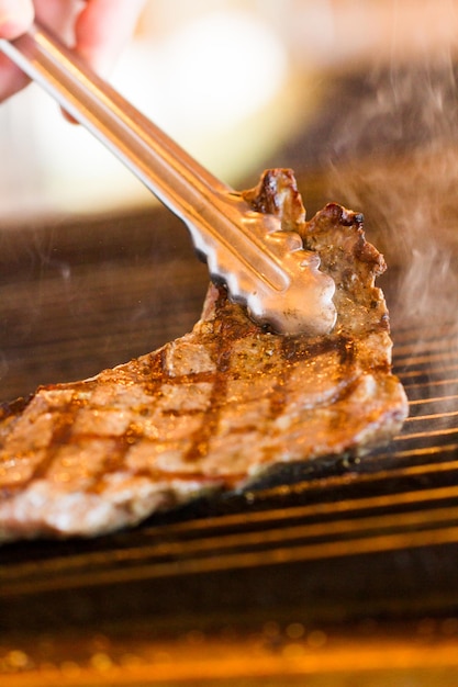 Slice of beef on barbecue grill.