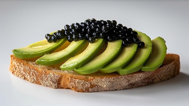 A slice of bread with avocado and black caviar