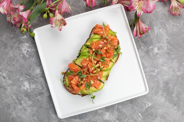 Slice of bread with salmon and avocado