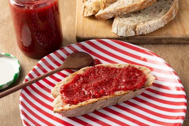 Slice of bread with strawberry jam