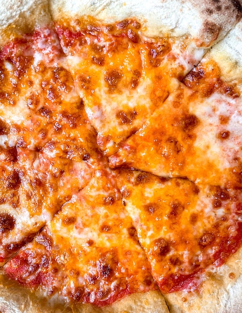 Slice of cheese pizza on plate close up