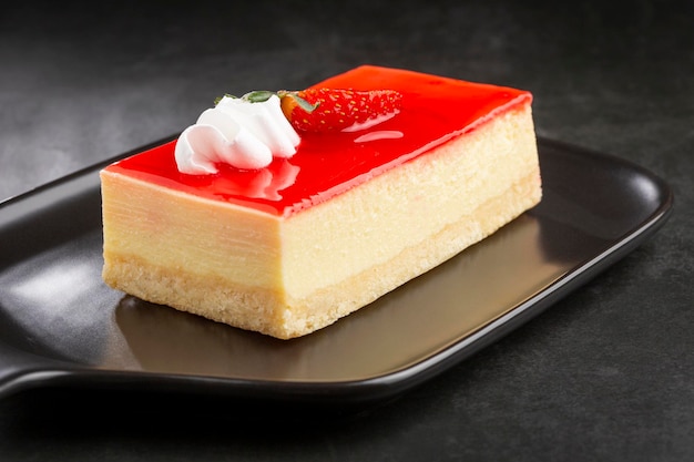 Slice of cheesecake with strawberry topping