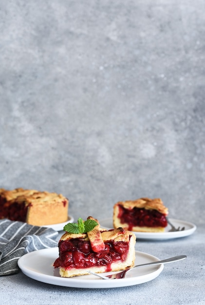 Slice of cherry pie on the kitchen table. Fruit pie. Tart.