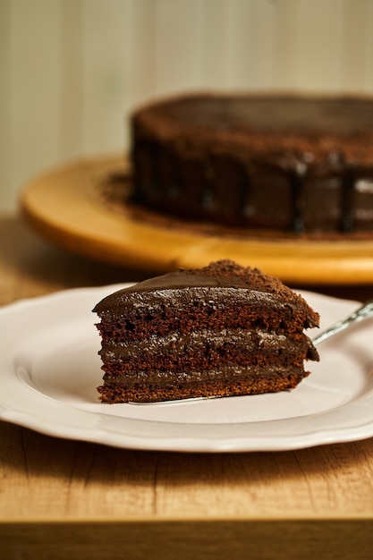 Slice of chocolate cake on plate.