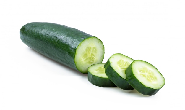 Slice of cucumber on white wall. 