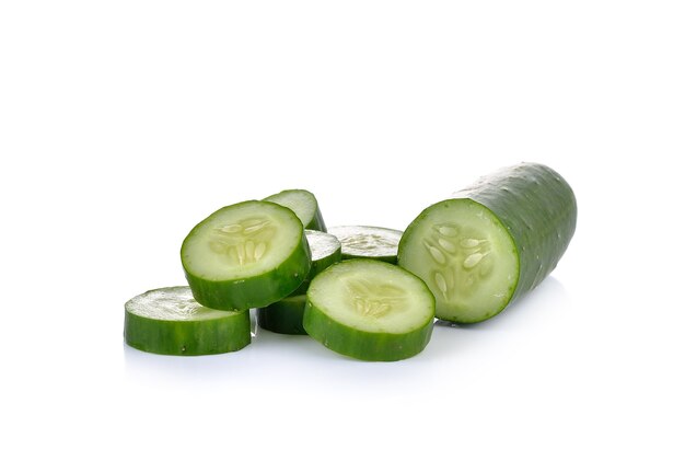 Slice of cucumber on white wall