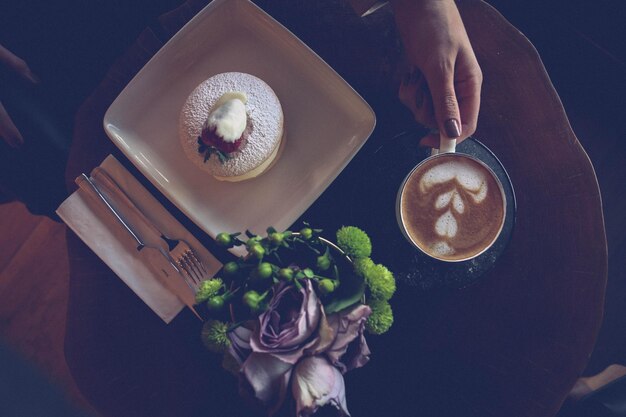 A slice of delicious cake and a cup of coffee