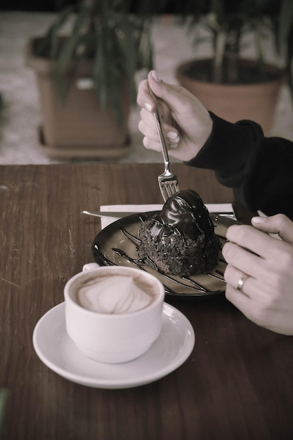 A slice of delicious cake and a cup of coffee