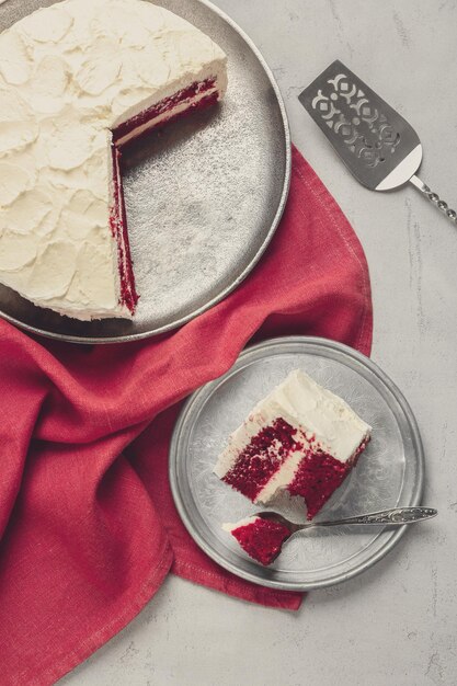 Slice of delicious red velvet cake on plate