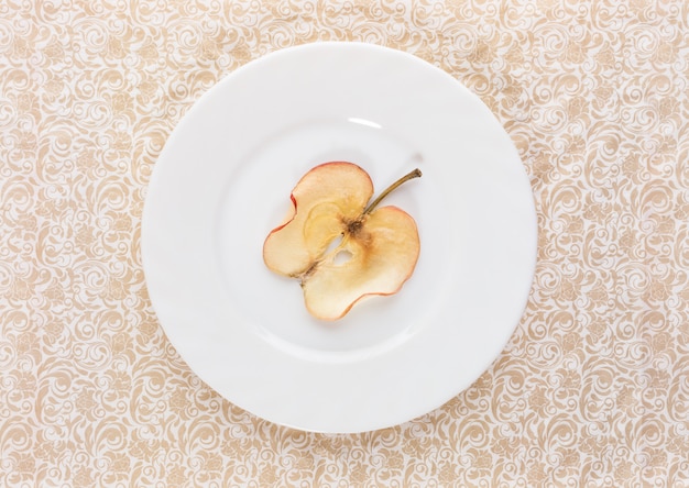 Slice of dried apple on plate