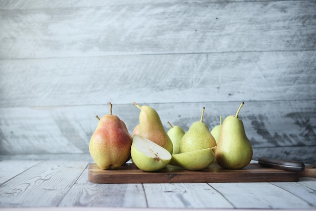 Slice of fresh pears on table close up
