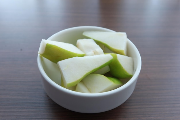 Slice of fresh pears on table close up