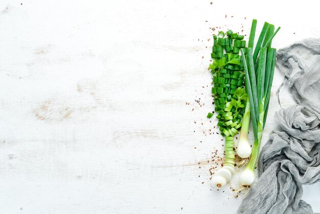 Slice green onions on a Wooden Table Fresh vegetables Top view Free space for text